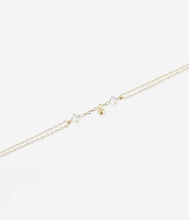 Bracelet Bruma Zag Bijoux – Double chaînette acier doré avec zirconiums