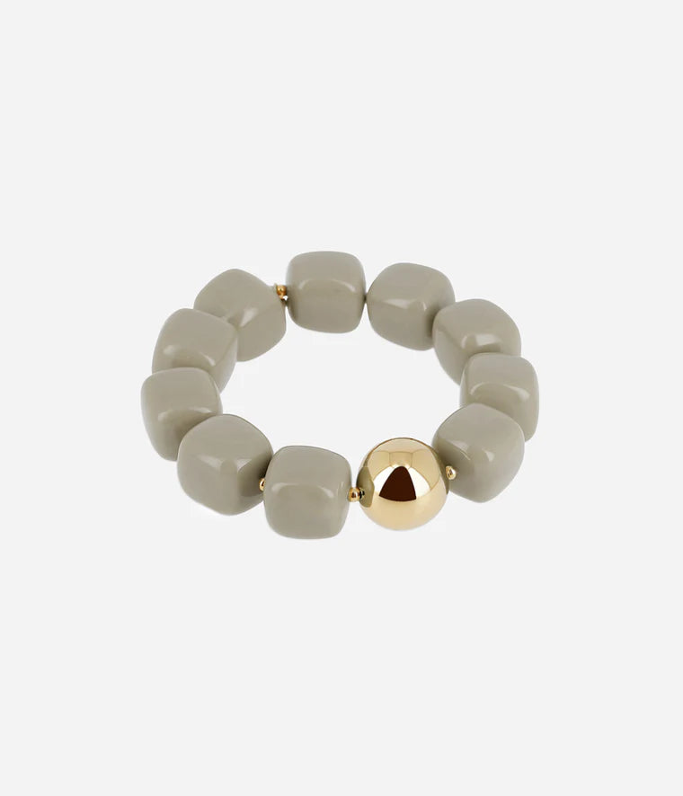 Bracelet Laïos Zag Bijoux en acier doré à l’or fin, orné de perles de résine colorées gris