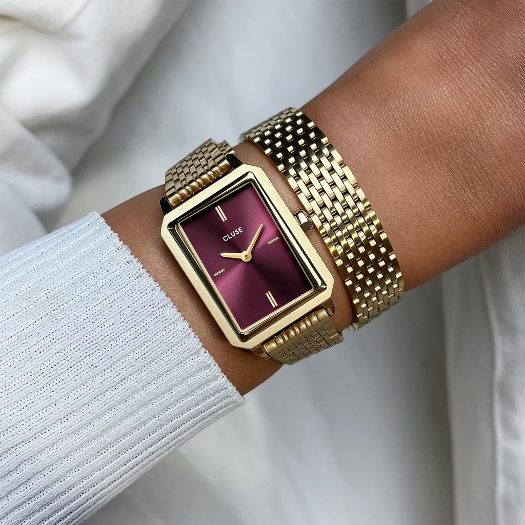 Montre Cluse Fluette femme. Boîtier doré rectangulaire 30,6 mm, cadran rouge vin et double bracelet acier 14 mm