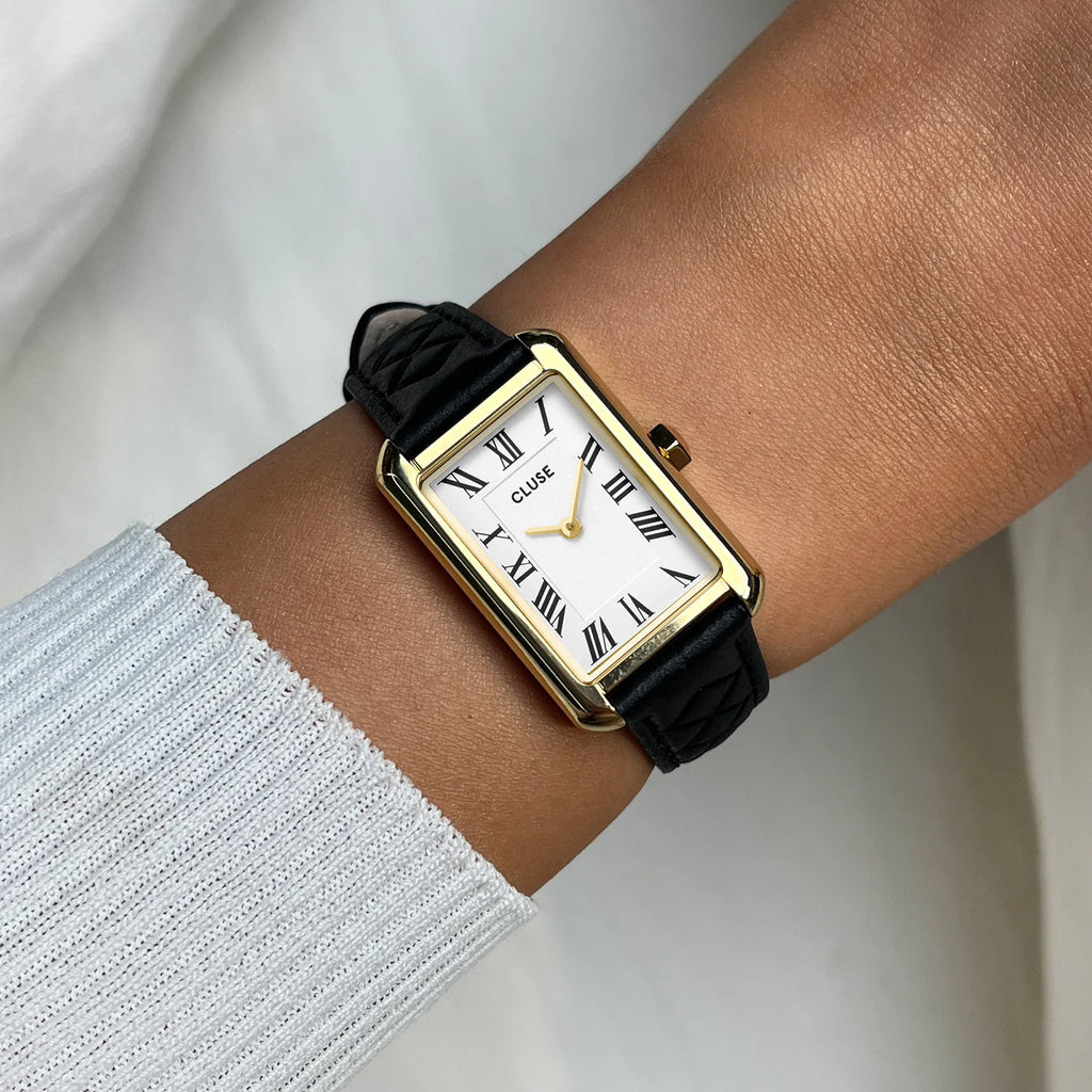 Montre Cluse Belisenna Femme – Boîtier doré 21 mm, cadran blanc et bracelet cuir noir matelassé
