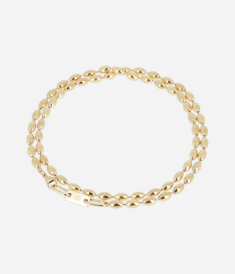 Sautoir Nyra Zag Bijoux en acier doré à l’or fin, maillons en forme de grains de riz